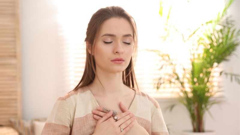 Decorative image of a woman meditating quietly and engaging in self-care