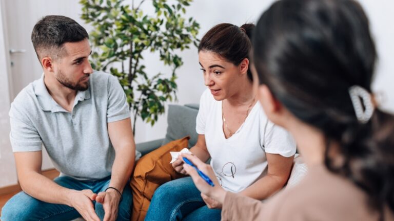 Decorative image of co-parents attending counseling together with a therapist